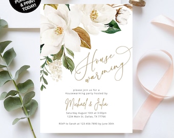 May include: A white invitation card with gold script text that reads "Housewarming." The card features watercolor floral elements, including white magnolia flowers and green leaves. The invitation is 5" x 7" and includes event details.
