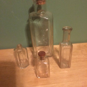 4 Vintage Perfume Bottles (Clear Colored Glass)