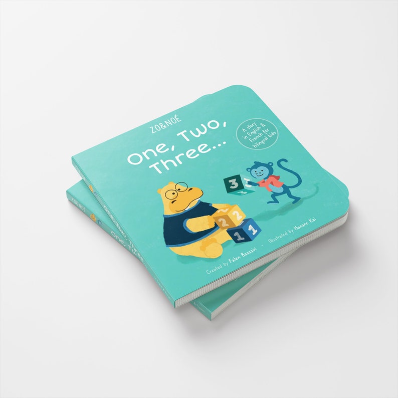 May include: A turquoise blue board book with the title "One, Two, Three..." in a playful font. The book features illustrations of a yellow hippopotamus wearing a blue shirt and a monkey holding a block with the number "3" on it. The book is part of the ZO&NO&Eacute; series.