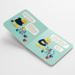 May include: A yellow hippopotamus wearing a blue shirt is counting colourful blocks with a monkey. The text on the page reads "Good morning No! What are you doing?" and "Bonjour Zo! Je compte les cubes, mais je crois que j'en ai perdu un."
