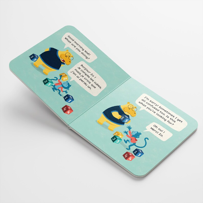 May include: A yellow hippopotamus wearing a blue shirt is counting colourful blocks with a monkey. The text on the page reads "Good morning No! What are you doing?" and "Bonjour Zo! Je compte les cubes, mais je crois que j'en ai perdu un."