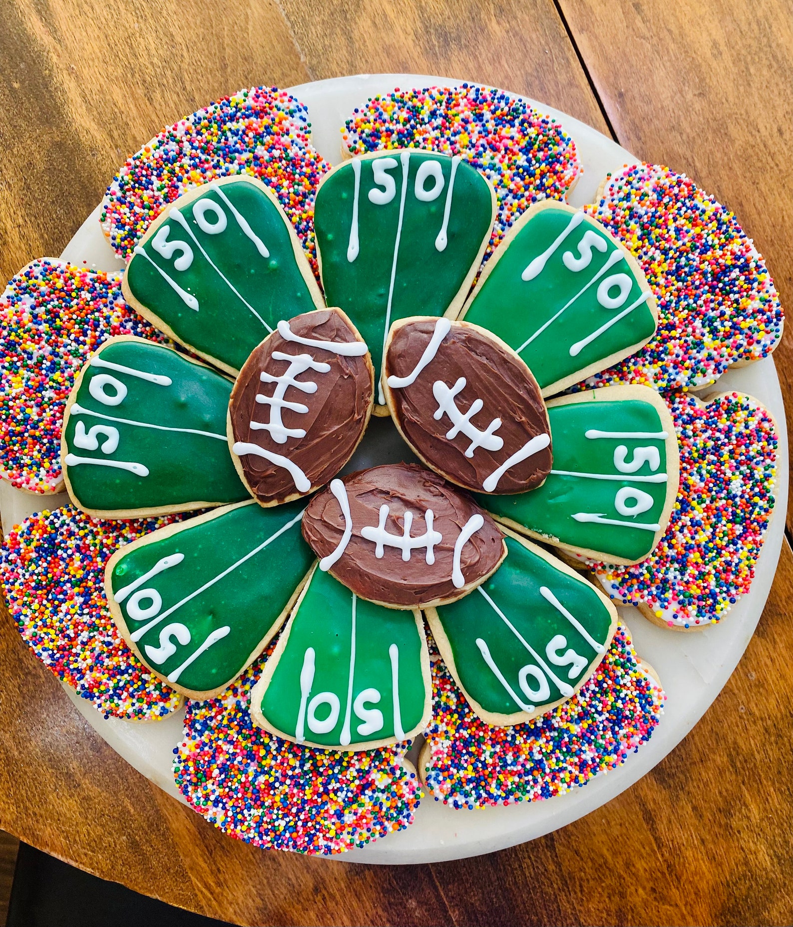 football shaped sugar cookie game day decorated royal icing team colours crowd party easy