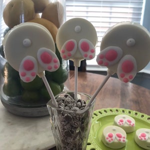 Chocolate covered Oreo bunny tails pop cookies