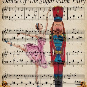 May include: A vintage-style print featuring sheet music with the title "Dance Of The Sugar Plum Fairy." A ballerina in a pink tutu and a nutcracker soldier are illustrated on the sheet music. The ballerina is in a ballet pose.
