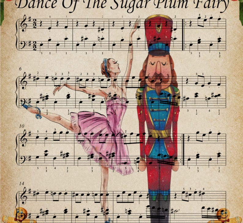 May include: A vintage-style print featuring sheet music with the title "Dance Of The Sugar Plum Fairy." A ballerina in a pink tutu and a nutcracker soldier are illustrated on the sheet music. The ballerina is in a ballet pose.