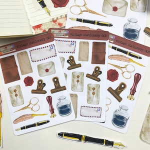 May include: Three sheets of vintage stationery stickers featuring illustrations of envelopes, pens, inkwells, feathers, and other stationery items. The stickers are labeled "vintage stationery 001", "vintage stationery 002", and "vintage stationery 003".