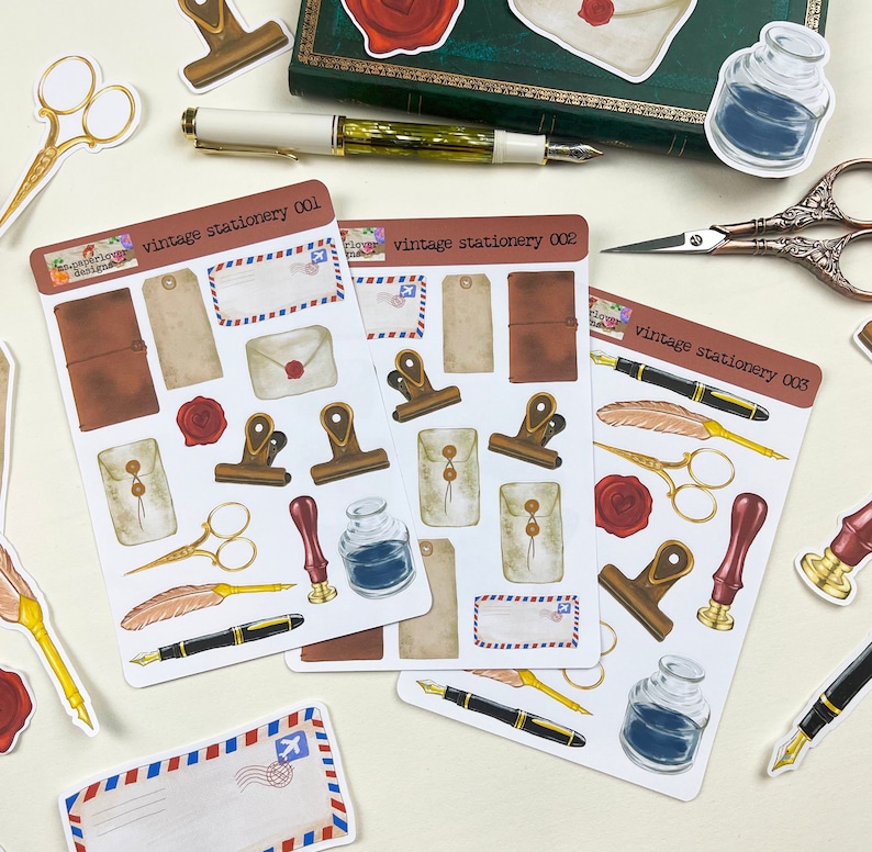 May include: Three sheets of vintage stationery stickers featuring illustrations of envelopes, pens, inkwells, and other stationery items. The stickers are labeled "vintage stationery 001", "vintage stationery 002", and "vintage stationery 003".