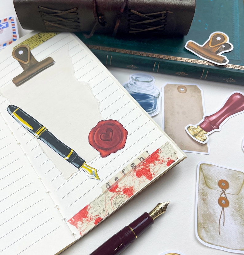 May include: A notebook with a variety of decorative stickers, including a wax seal, a pen, a bottle of ink, and a tag. The notebook has lined pages and a brown leather cover.