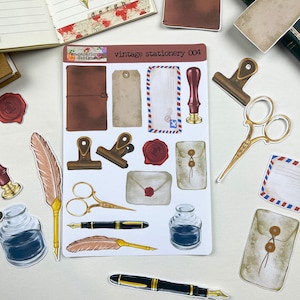 May include: Vintage stationery sticker sheet with images of envelopes, feathers, ink bottles, scissors, and a stamp. The sheet is white with a brown border and the text "vintage stationery 004" in black.