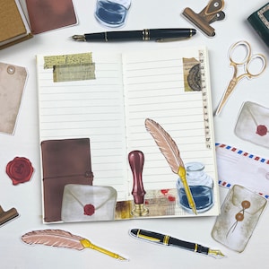 May include: A notebook with lined pages and a variety of stickers, including a quill pen, an inkwell, a stamp, and envelopes. The stickers are in a vintage style and have a brown, red, and gold color scheme.