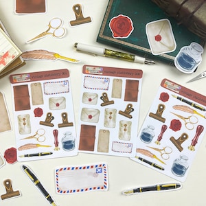 May include: A set of three sheets of vintage stationery stickers featuring illustrations of envelopes, stamps, pens, inkwells, and other stationery items. The stickers are labeled "vintage stationery 001", "vintage stationery 002", and "vintage stationery".