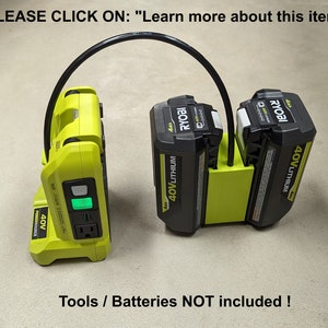 May include: A lime green and black power source with two black 40V Lithium batteries attached. The power source has an outlet and a green power indicator. The text "PLEASE CLICK ON: Learn more about this item" is at the top.