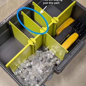 May include: A lime green plastic divider for a tool organizer box. The divider is rectangular with notched edges for slotting into a container. The image includes a blue circle highlighting the part and text stating: You are buying just this part.