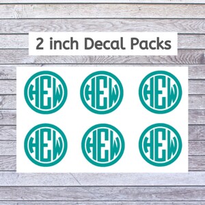 May include: Six 2 inch teal blue monogram decals with the letters HEW in a circle.  2 inch Decal Packs.