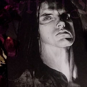 May include: Black and white drawing of a person with long dark hair. The person is looking directly at the viewer. The drawing is on a white background with the text "in each others arms we'll drown in flame" written in cursive.