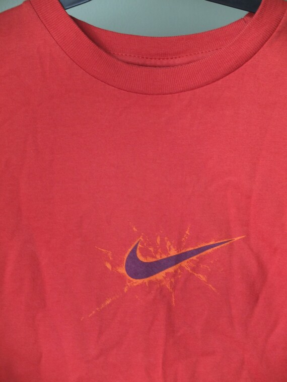 burnt orange nike shirt