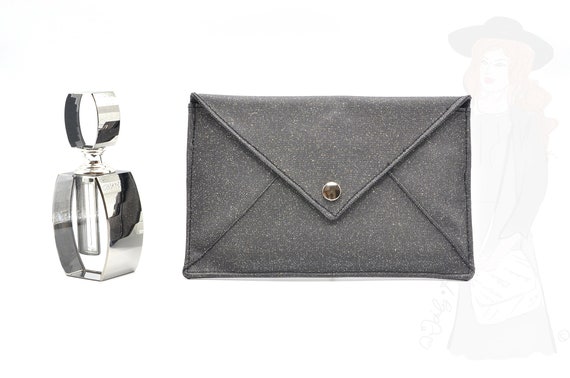 black glitter clutch bag