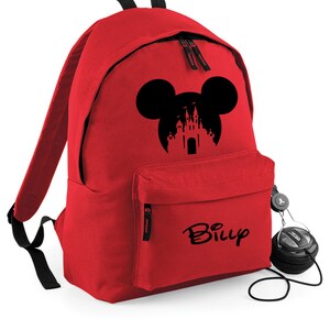 May include: Red backpack with a black Mickey Mouse silhouette with a castle inside the ears. The backpack has a black zipper and a black pocket on the front. The name "Billy" is written in black on the front pocket.
