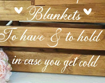 May include: Wooden crate with the text "Blankets To have & to hold in case you get cold" written in white on the front. The crate is made of natural wood and has a rustic look.