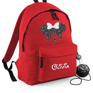 May include: Red backpack with a black glitter Minnie Mouse design and the name "Olivia" embroidered in white on the front.