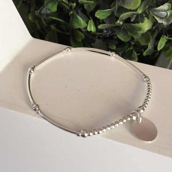 bracelet perles /tubes en Argent