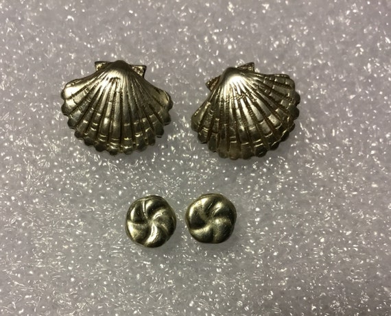 Sea shell stud earrings.Fine silver shell and twisted knot stud earrings .