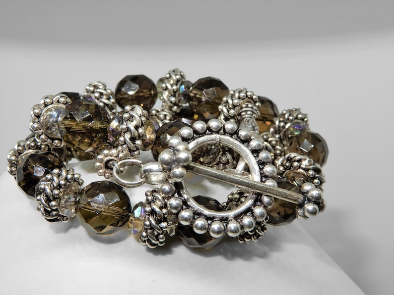 Silver from Bali 16 Necklace Smokey topaz colored quartz with integral locking silver beads A nice oversized toggle is a good finish.