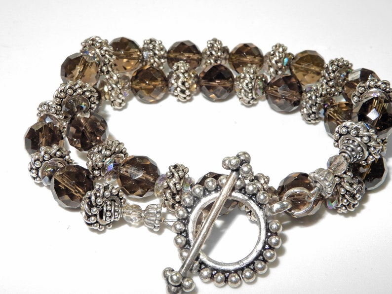 Silver from Bali 16 Necklace Smokey topaz colored quartz with integral locking silver beads A nice oversized toggle is a good finish.
