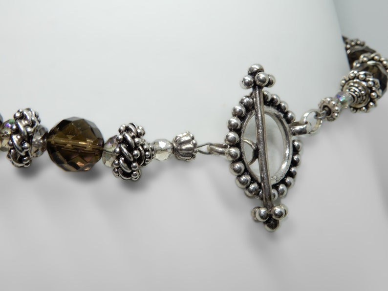 Silver from Bali 16 Necklace Smokey topaz colored quartz with integral locking silver beads A nice oversized toggle is a good finish.