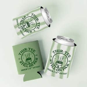 May include: Three foam can coolers in sage green and white. Two feature vertical stripes and one is solid sage green. All display a circular graphic with golf clubs in a bag and the text: THIR-TEE & STILL ON PAR, EST. 1986, ANDREW'S 30TH BIRTHDAY.