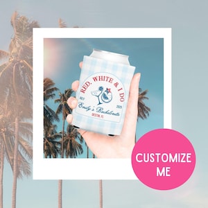 May include: A blue and white can cooler with a red, white and blue design. The text on the cooler says "Red, White & I Do" with the date "July 2025" and "Emily's Bachelorette" with the location "Destin, FL".