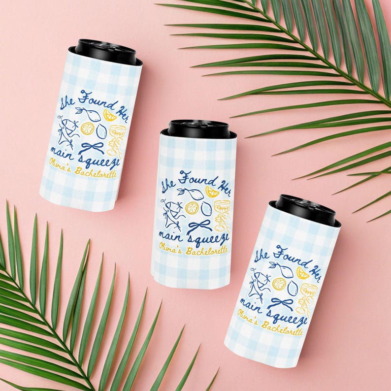 May include: Three white and light blue checkered can coolers with black tops. Each cooler has the text "She Found Her main squeeze Olivia's Bachelorette" with illustrations of lemons, bows, and a person running.