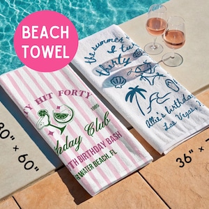 May include: Two rectangular beach towels measuring 30" x 60" and 36" x 72". One towel features pink and white vertical stripes with a margarita graphic and text, while the other is white with blue line art of beach icons and custom text.