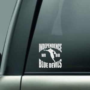 May include: White vinyl decal with the text "Independence WR 88 Blue Devils" and a silhouette of a football player catching a ball.