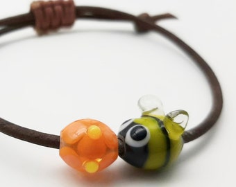 Adjustable bumble bee and flower lampwork glass bead woven leather friendship bracelet