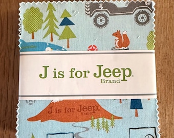 May include: A stack of square fabric swatches with pinked edges featuring a light blue background with a pattern of grey off-road vehicles, green trees, and orange squirrels. A white paper band wraps around the center with the text J is for Jeep Brand.