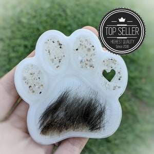 Memorial keepsake made with fur and cremation ashes. Paw shaped hangable display for pet memorial. Pet loss gift. Custom colors. Paw print.