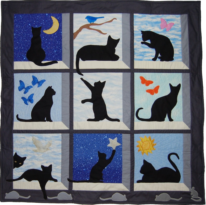 May include: A quilt with nine squares, each featuring a black silhouette of a cat in a different pose. The backgrounds of the squares are different colors and patterns, including blue, white, and yellow.