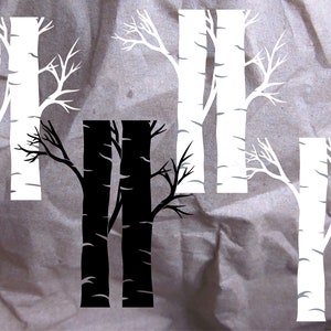 May include: Three sets of white birch trees with bare branches. The middle set is black. The rightmost set has a red heart in the center.