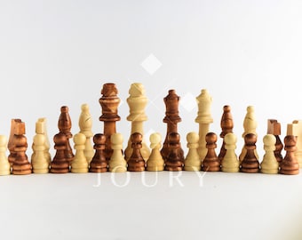 May include: A set of wooden chess pieces in brown and natural wood tones. The pieces are arranged in a line, with the king and queen in the center.