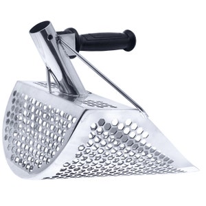 May include: A silver metal scoop with a black handle and a honeycomb-shaped mesh. The scoop is designed for scooping sand or gravel.