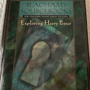 May include: A book titled "Exploring Harry Potter" with the subtitle "Beacham's Sourcebooks for Teaching Young Adult Fiction". The cover features a green and blue keyhole design.