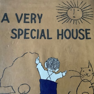 May include: A book cover with the title "A Very Special House" in black text on a brown background. A simple line drawing of a child drawing a house with a cat and a sun in the sky.