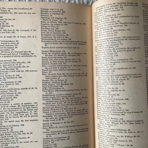 May include: An open book with yellowed pages, showing a dictionary of words and their definitions. The book is open to the letter "F" and includes words like "Faith", "Family", "Fear", and "Future".