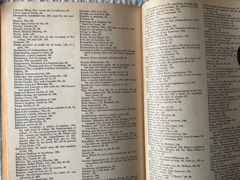 May include: An open book with yellowed pages, showing a dictionary of words and their definitions. The book is open to the letter "F" and includes words like "Faith", "Family", "Fear", and "Future".