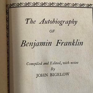 May include: The Autobiography of Benjamin Franklin, compiled and edited with notes by John Bigelow. The title is printed on a white page with a decorative black border.