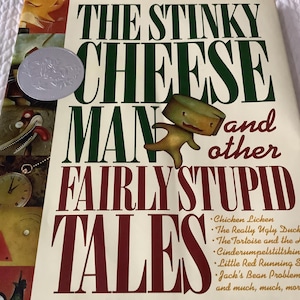 May include: A book cover for "The Stinky Cheese Man and Other Fairly Stupid Tales" features a whimsical illustration of a cheese man. The title is in large green and burgundy letters. A silver coin is on the upper left.