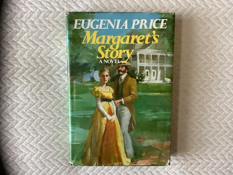 May include: A vintage paperback book cover featuring a painting of a couple standing in a garden. The book title is "Eugenia Price Margaret's Story A Novel".