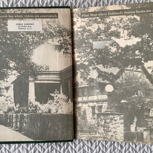 May include: A black and white photo of the Roycroft Inn, a building with a stone wall and a walkway leading to the front door. The text "The Roycroft Inn where visitors are entertained." is printed above the image. The text "ADELE BAHOODY 101 Kuker Av. Florence, S.C." is printed below the image.