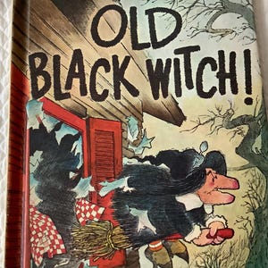 May include: A vintage book cover with the title "OLD BLACK WITCH!" in bold black letters. The cover features an illustration of a witch with a broom and a red house in the background.